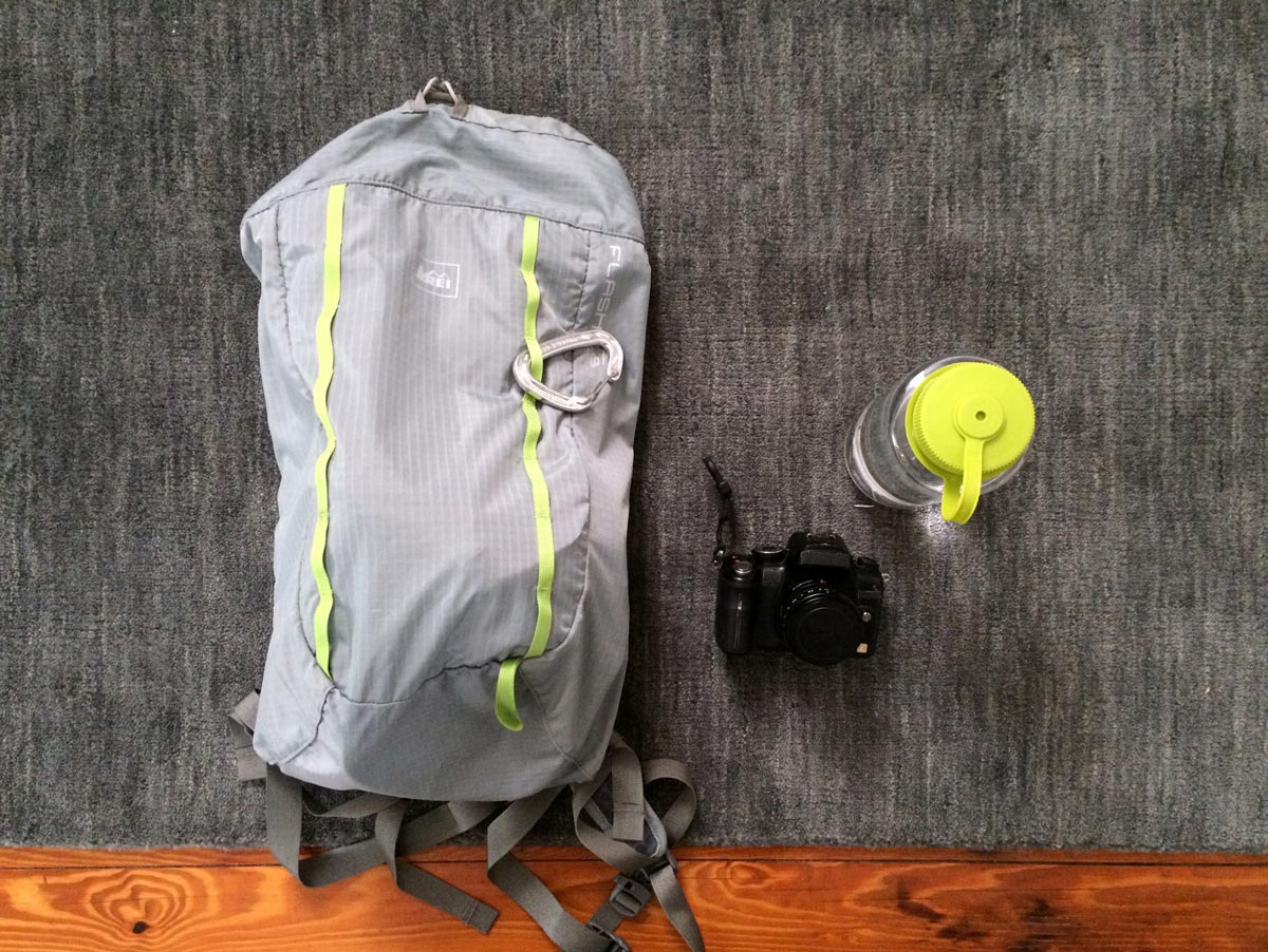 REI Flash 18 backpack and Nalgene water bottle
